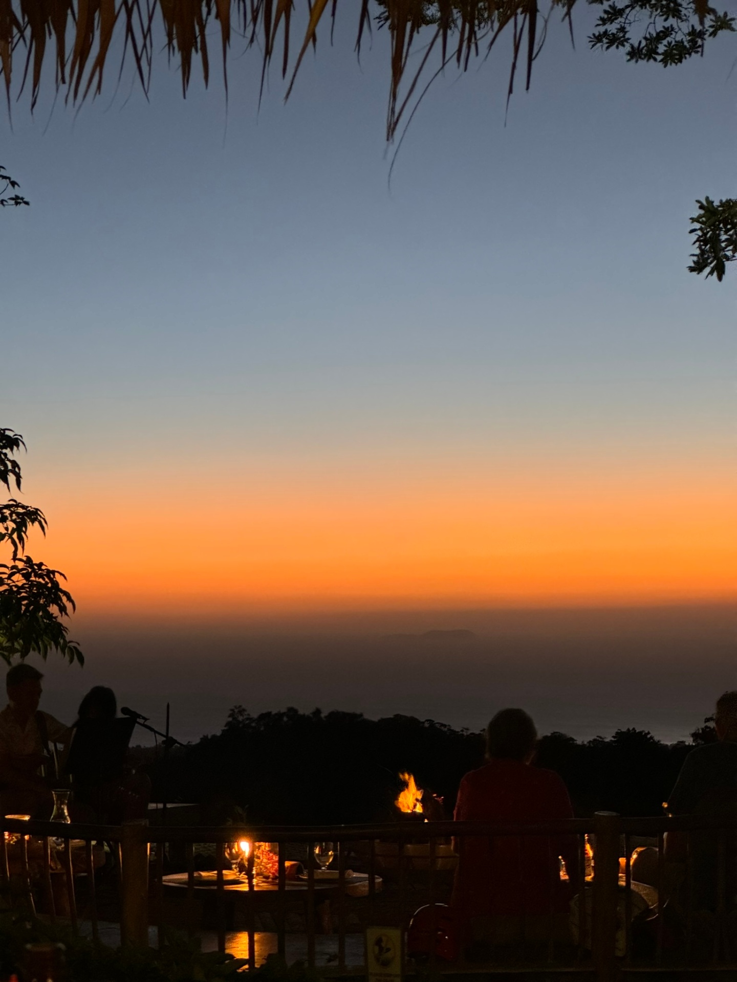 Sunset dinner with ocean view from a hilltop
