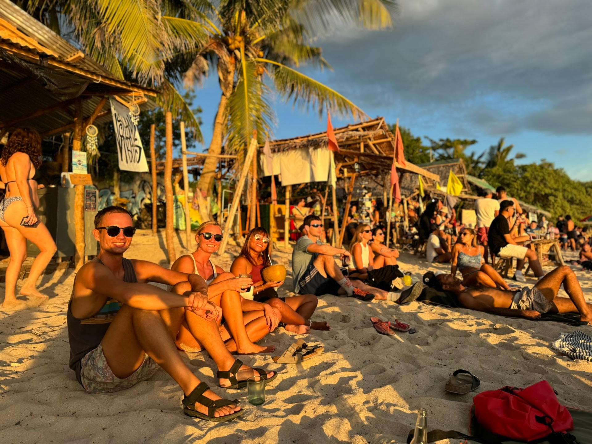 Sunset gathering at a beach bar in San Juan