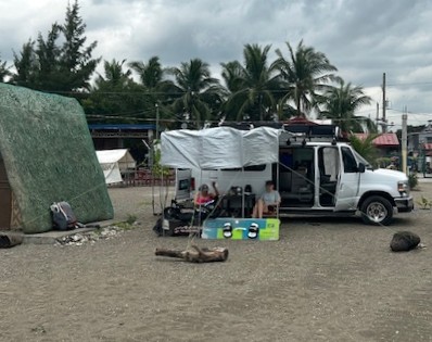 Surf Zone van set up with gear on a Philippine beach