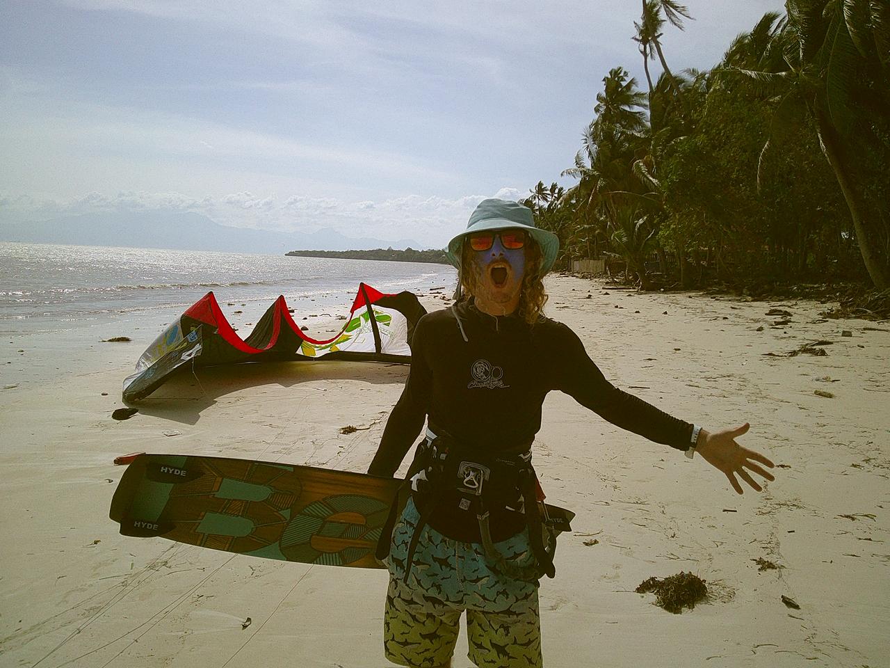 Local Siquijor kitesurf instructor on the beach with kite and board